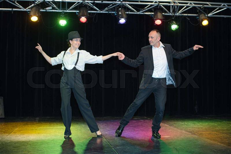 Couple dancing on stage, stock photo