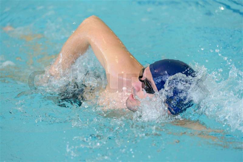 Male swimmer doing front crawl, stock photo