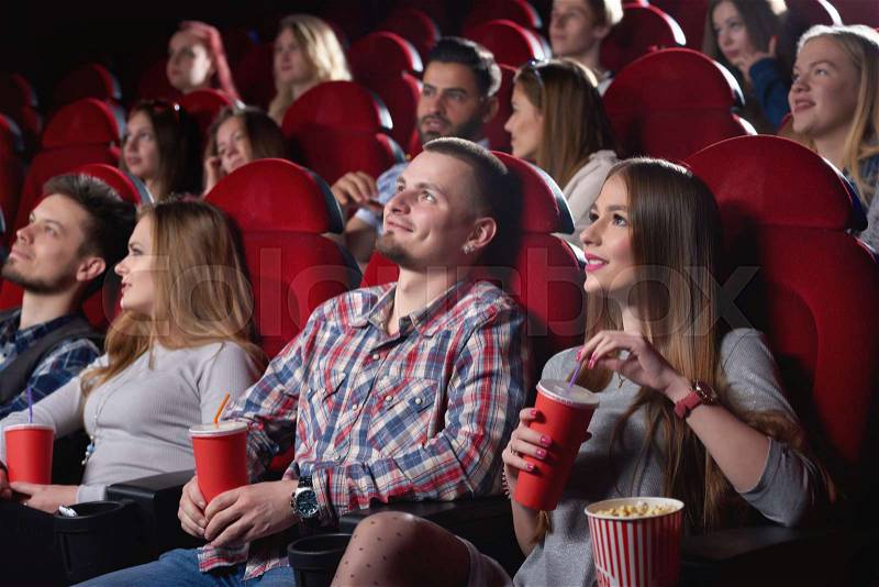 Shot of cinema auditorium full of spectators enjoying watching a movie people lifestyle leisure entertainment happiness positivity emotions concept, stock photo