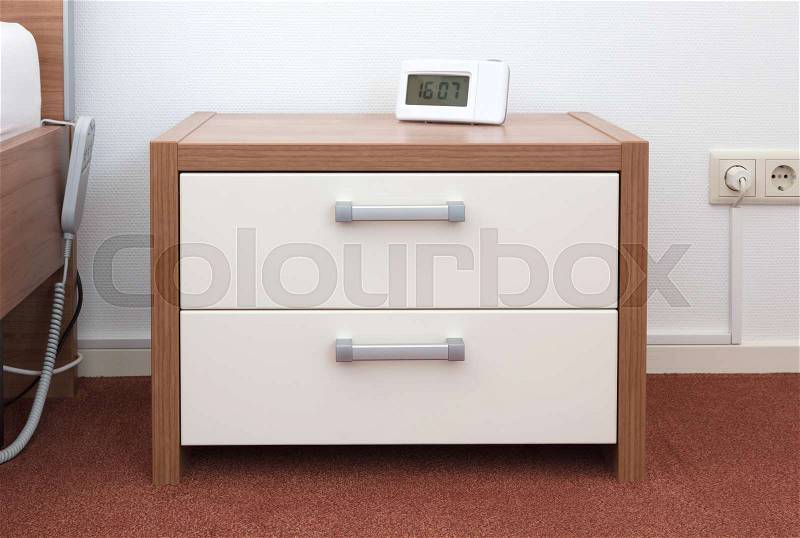 Bed and bedside table, modern design (wood), stock photo