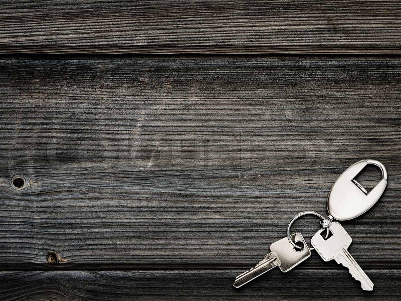 Keys with key ring over the wooden background, stock photo