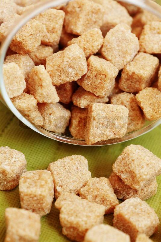 Brown sugar cubes in a bowl, stock photo