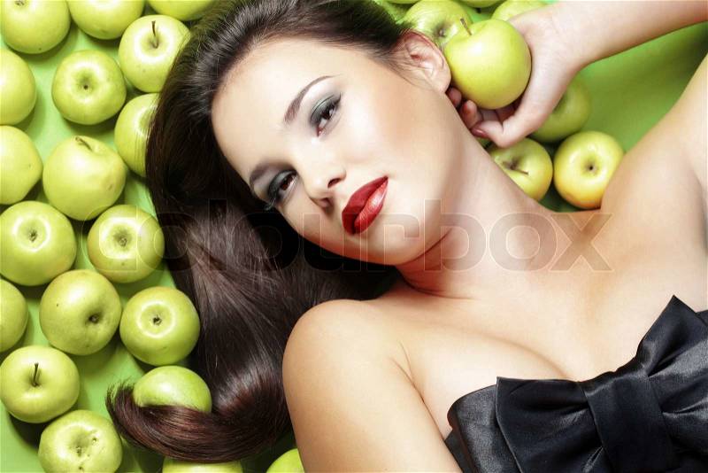Portrait of young beautiful woman with apples, stock photo
