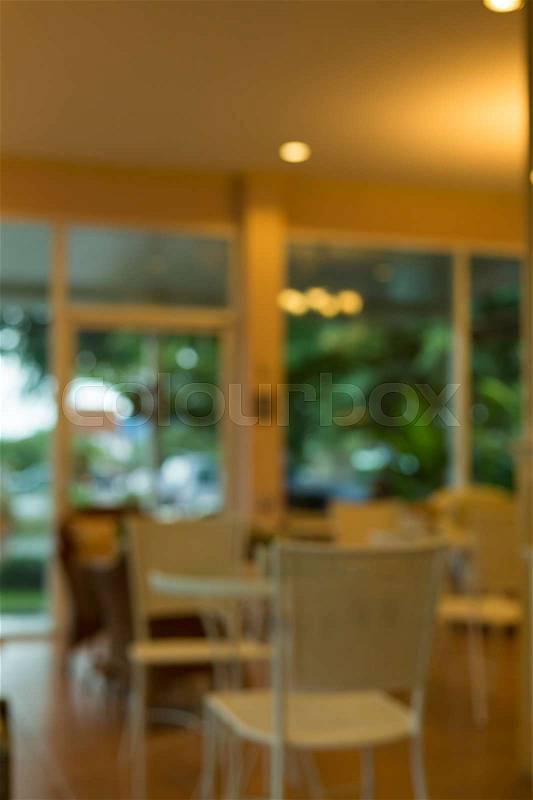 Cafe coffee shop interior decoration with warm light, abstract blur background, stock photo