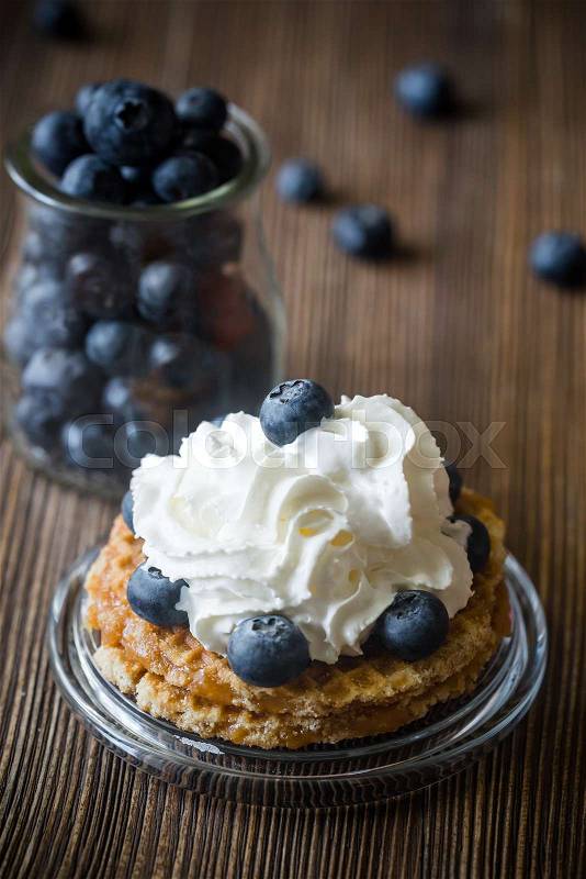 Waffle with whipped cream and fresh berries, stock photo