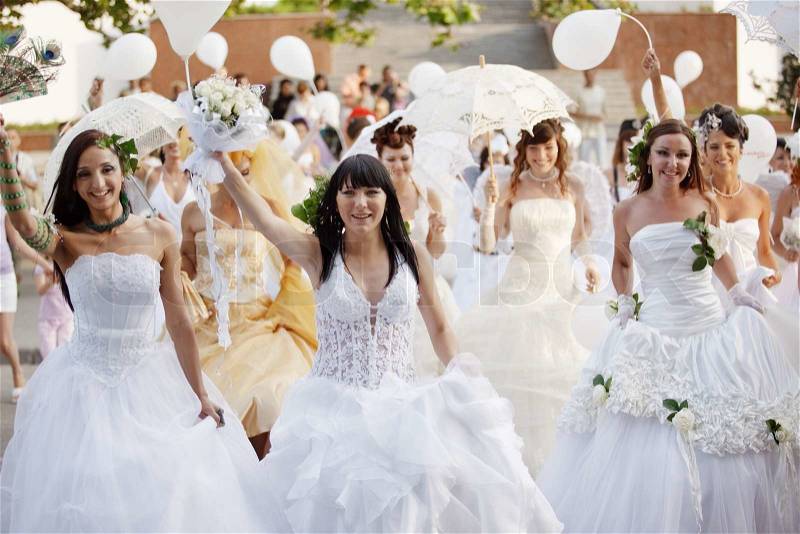 Large group of beautiful brides celebrating holiday, stock photo