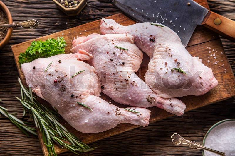 Chicken legs. Raw chicken legs with salt pepper and herbs, stock photo