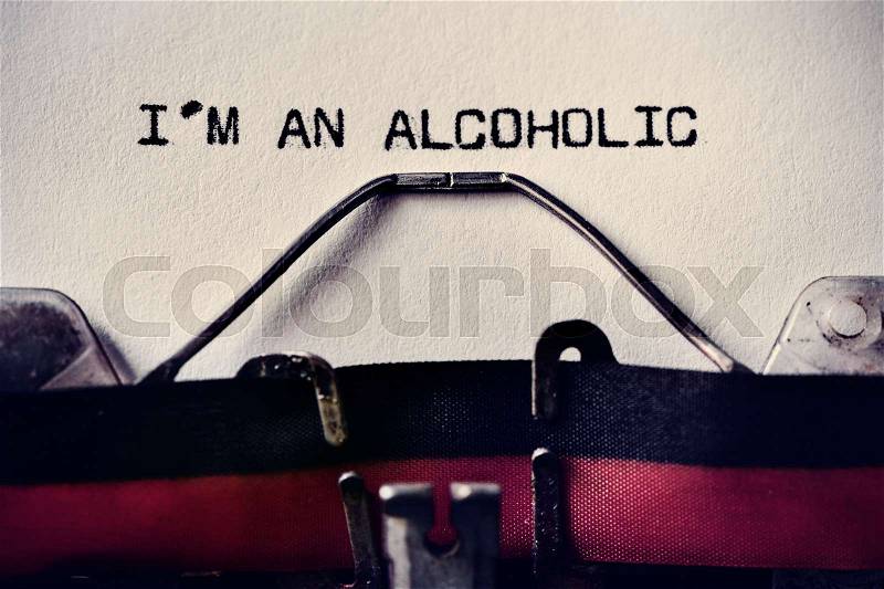 Closeup of an old typewriter and the text I am an alcoholic typewritten with it in a foil, stock photo