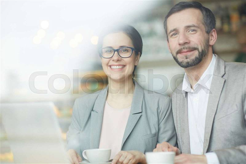 Caucasian colleagues spending free time in cafe, stock photo