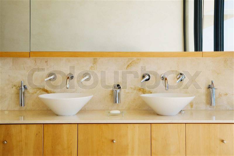 Modern bathroom vanity and sinks can be as background, stock photo