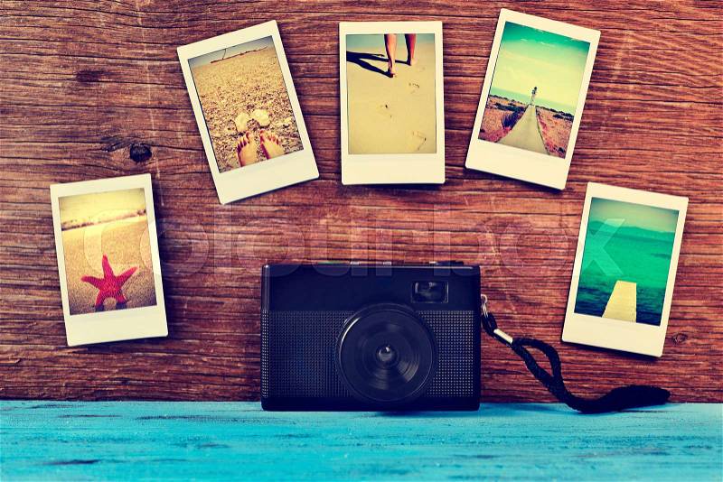 A retro camera and some instant photos of summer scenes, shot by myself, attached to a rustic wooden surface, stock photo