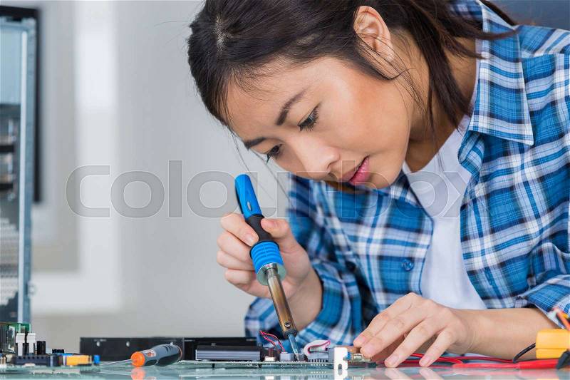 Female electronics technician, stock photo