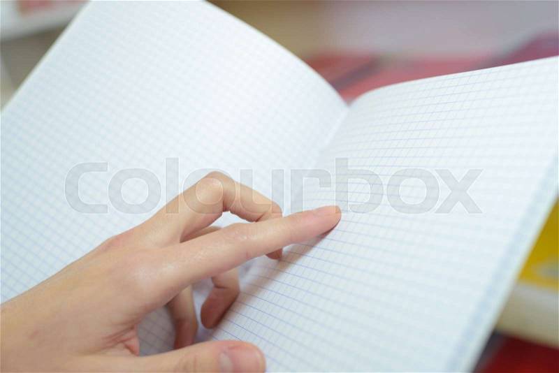 Empty book opened with hand, stock photo