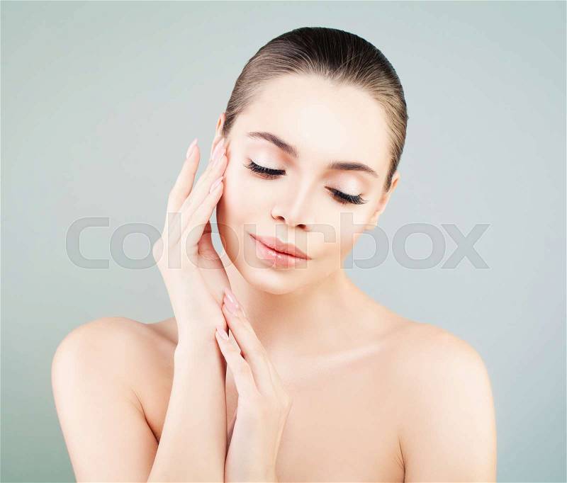 Spa Model Woman with Healthy Skin touching her Hand her Skin. Skincare, Facial Treatment and Cosmetology, stock photo