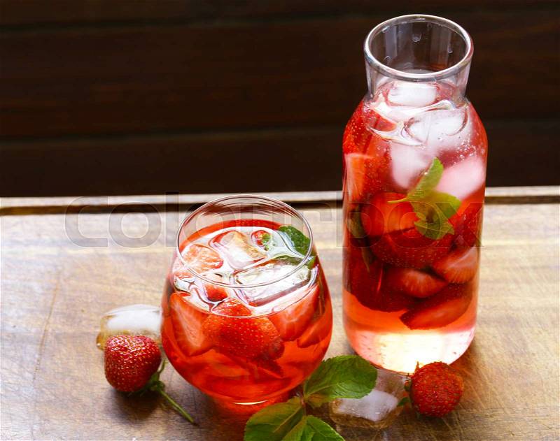 Homemade summer strawberry drink with mint and ice, stock photo
