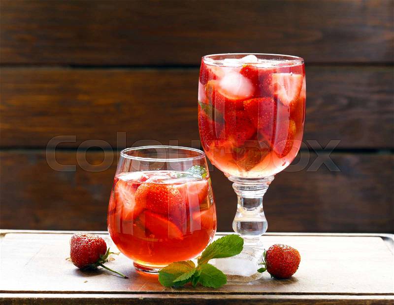 Homemade summer strawberry drink with mint and ice, stock photo