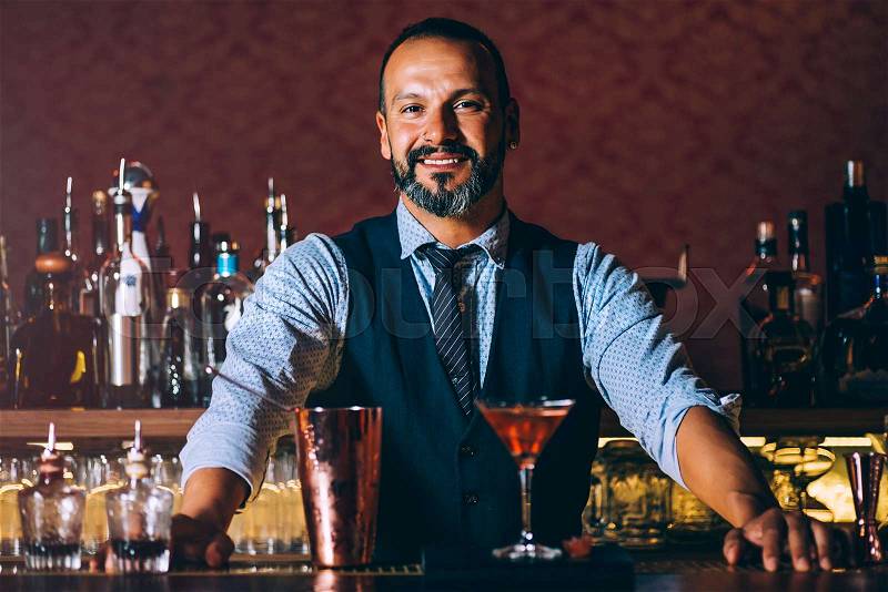 Barman is making cocktail at night club.Barman is making cocktail at night club, stock photo