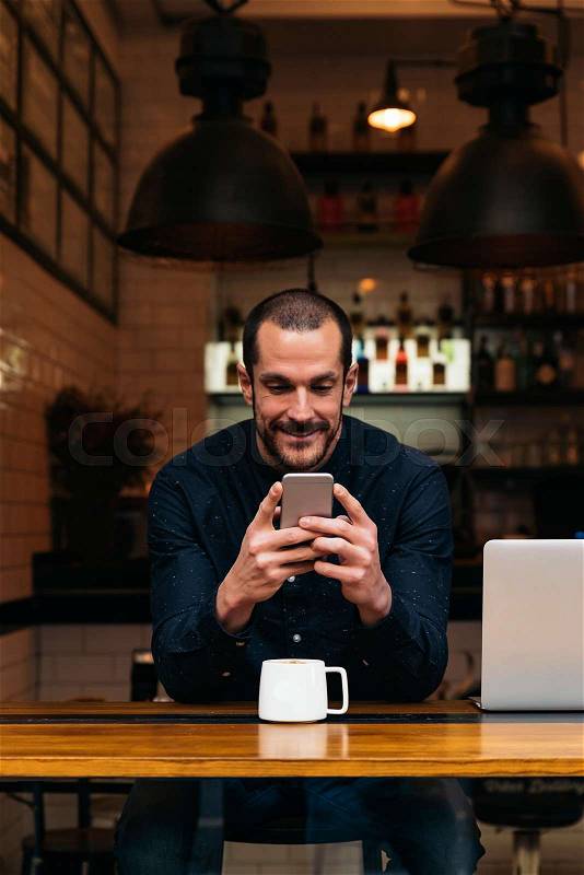 Businessman using his mobile in the Coffee Shop. Business Concept, stock photo