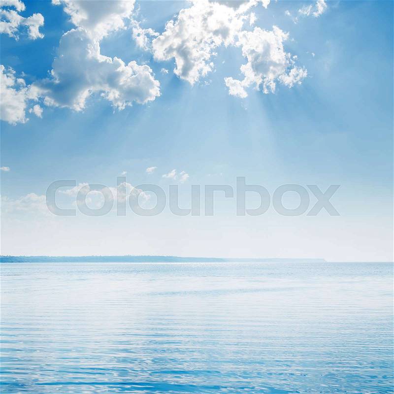 Blue sky with clouds over big river, stock photo