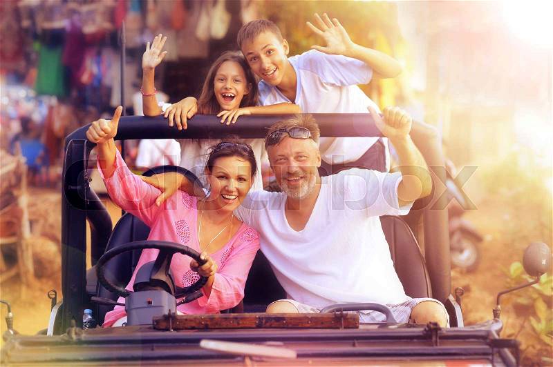 Portrait of big happy family in car, stock photo