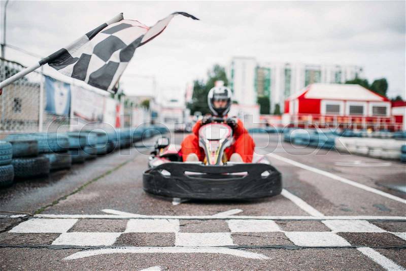Carting racer on start line, front view, go cart driver, stock photo