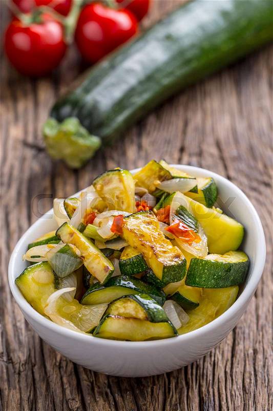 Zucchini. Zucchini salad. Grill Zucchini with onion an chili pepper. Salad with grill vegetable, stock photo