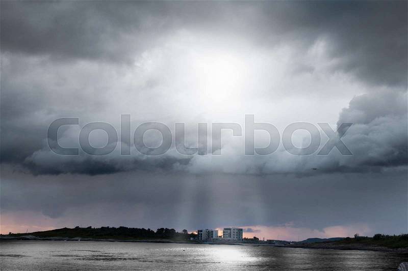 Heavy clouds at Giske, Norway, stock photo