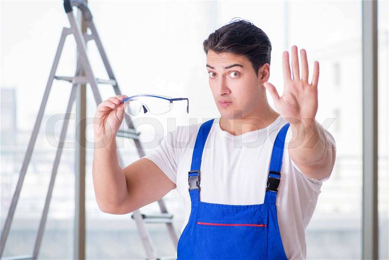 Young worker with safety goggles, stock photo
