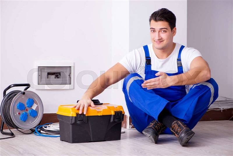 Man doing electrical repairs at home, stock photo
