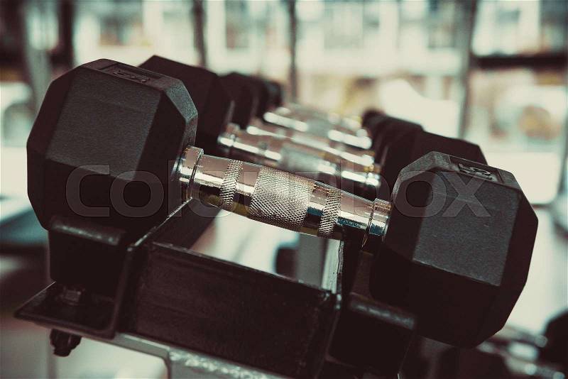 Dumbbells in the gym at sports club for exercise and Bodybuilding, stock photo