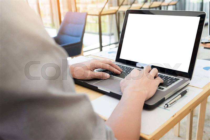 Business man working by using laptop computer. hand typing on laptop keyboard in his office, stock photo