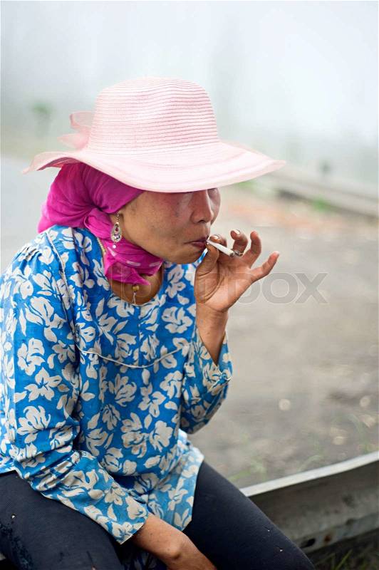 Cigarette Smoking in Indonesia is a common practice, as over 165 million people smoke in Indonesia Of Indonesian people, 63% of men and 5% of women reported as smokers, a total of 34% of the population, stock photo