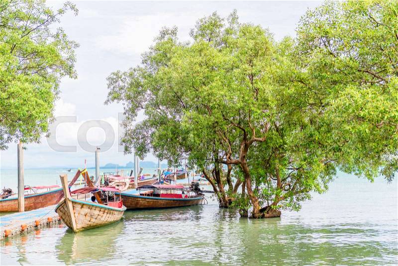 Pier with traditional Thai wooden boats, sea view, stock photo