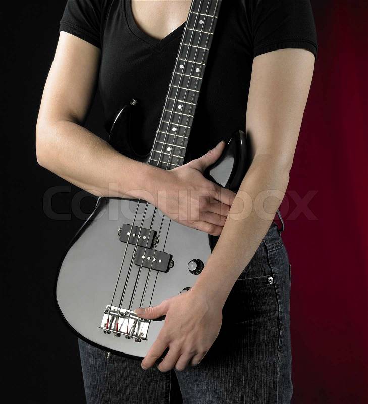 Woman with bass guitar, stock photo