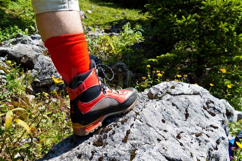 Red hiking boots for a hike in the mountains of austria activity in leisure time, stock photo