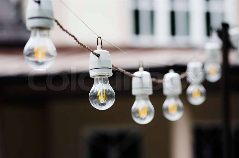 Decorative outdoor string lights hanging, stock photo