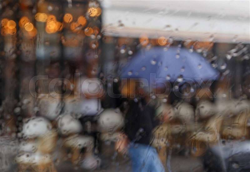 Street of Paris at rain, stock photo