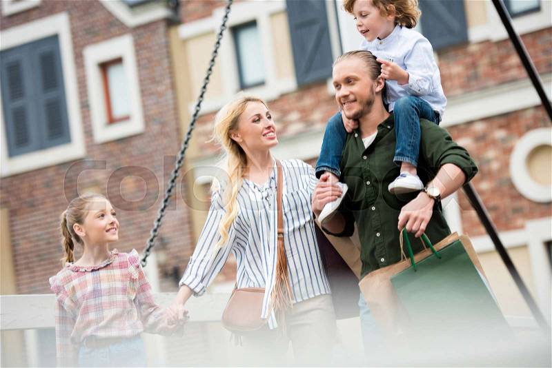 Portrait of big happy family walking on street after shopping at street , stock photo