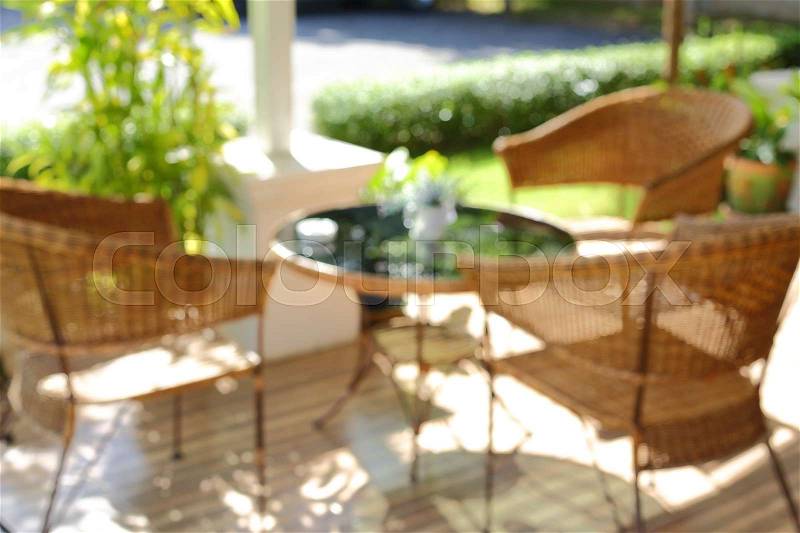 Blur image interior decoration, glass table and seat chair outside the garden, stock photo