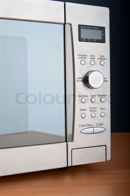 Microwave oven on the table, stock photo