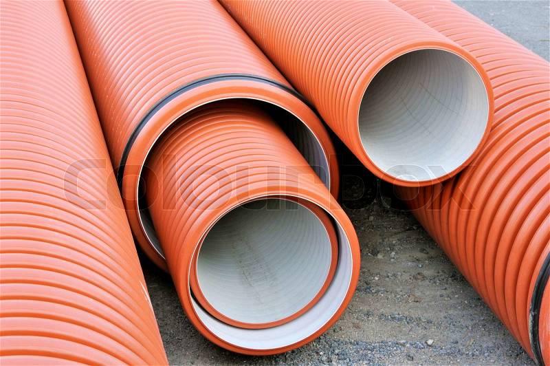 Plastic drainage pipes stacked - sewage conduit, stock photo