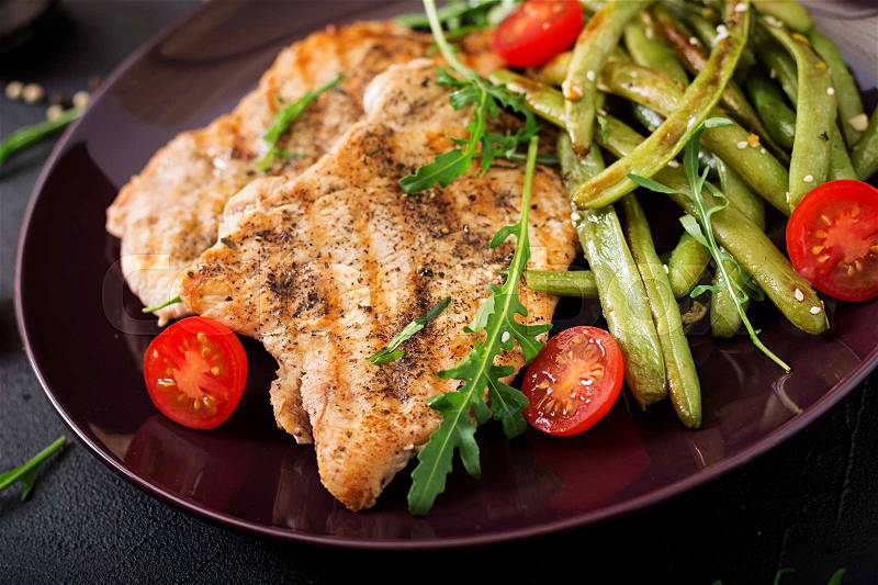 Turkey- chicken fillet cooked on a grill and garnish of green beans, stock photo