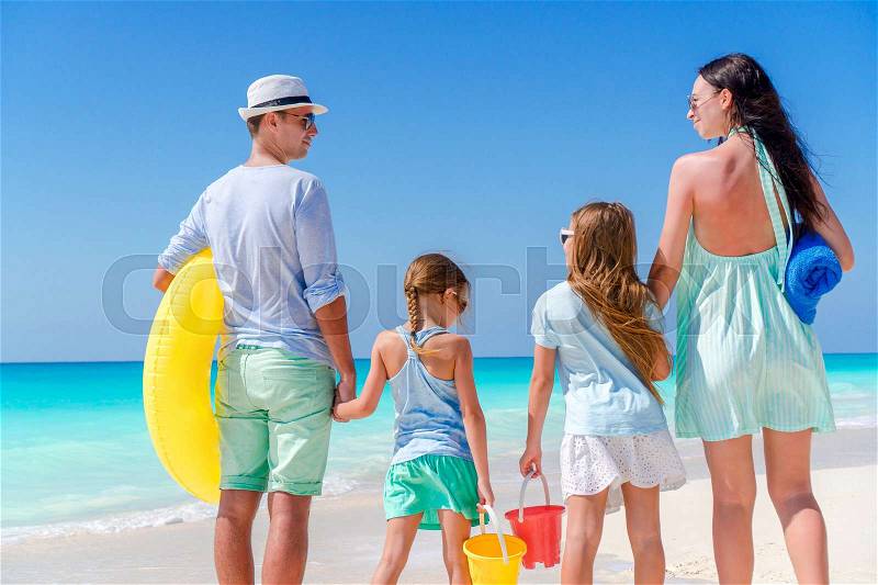 Young family on vacation on the beach. Family travel concept, stock photo