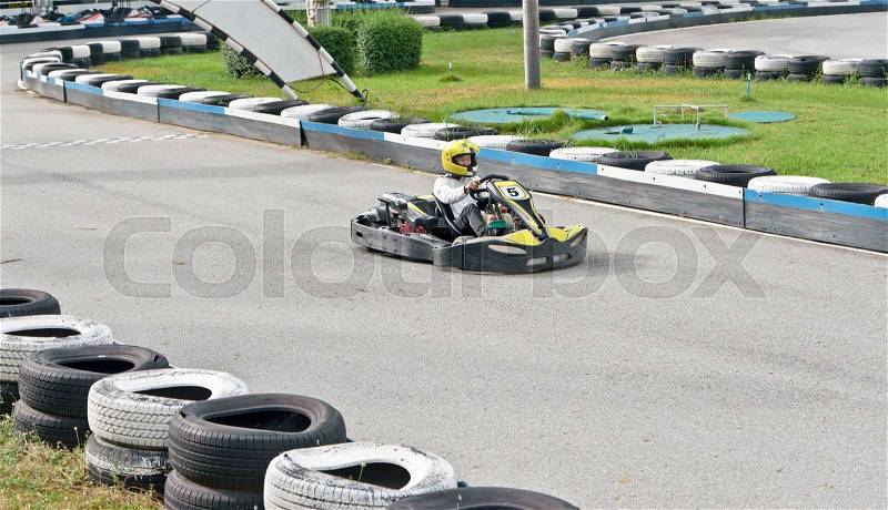 Go kart racer on the outdoor track , stock photo