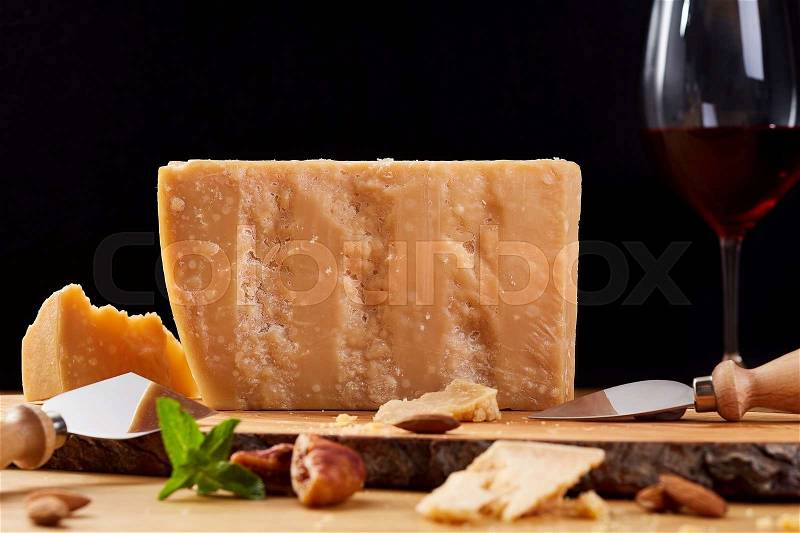 Dutch goat cheese zwart on a wooden board. Cheese and red wine, stock photo