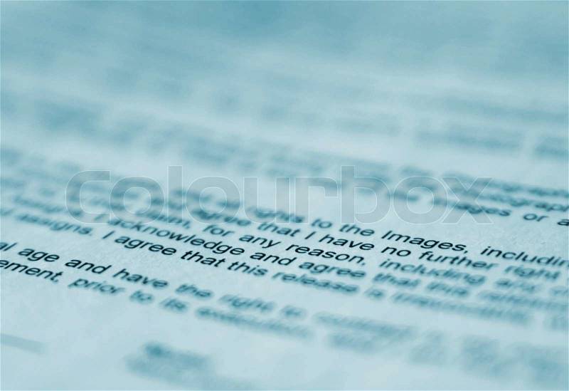Macro shot of a printed text in blue tint, stock photo