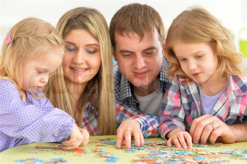 Portrait of friendly happy family playing together, stock photo
