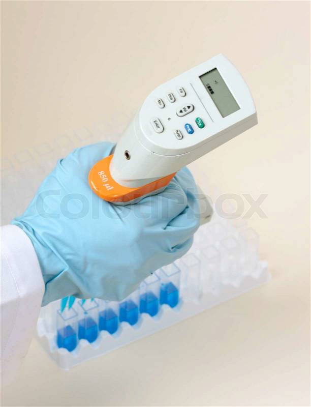 Above view hand using a multi channel pipette, stock photo