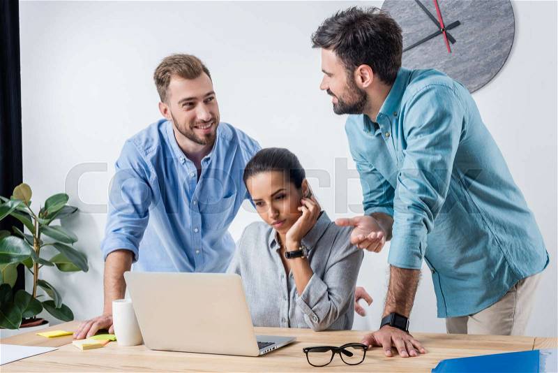 Group of business people discussing new project at workplace in office, stock photo