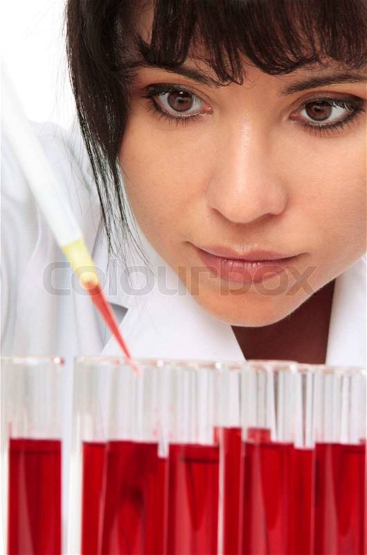 Chemist or other lab worker takes a sample from test tube, stock photo